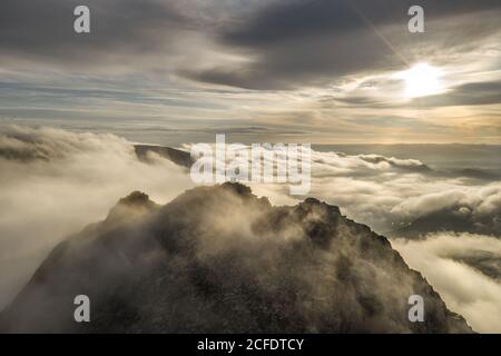 Tryfan mountain in Snowdonia aerial sunrise with cloud inversion Stock Photo
