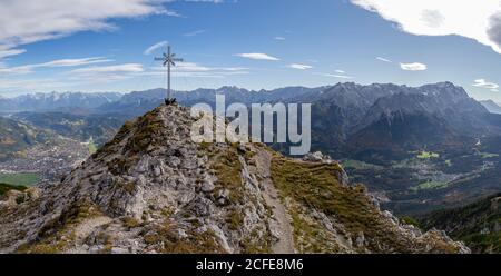 Panoramic photo from the Kramer summit with a view over Garmisch-Partenkirchen, Grainau, Karwendel Mountains and Wetterstein Mountains (with Stock Photo