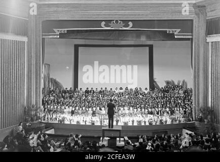 Original Caption:  Large choir group in Al Hambra [i.e. Alhambra] cinema Jaffa March 22 '44  - Location: Tel Aviv Israel ca. Stock Photo