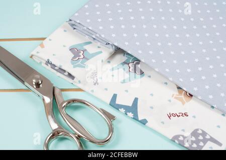 Dressmaking or tailoring scissors on cotton fabric Stock Photo
