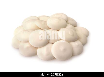 Pile of white chocolate buttons isolated on white Stock Photo