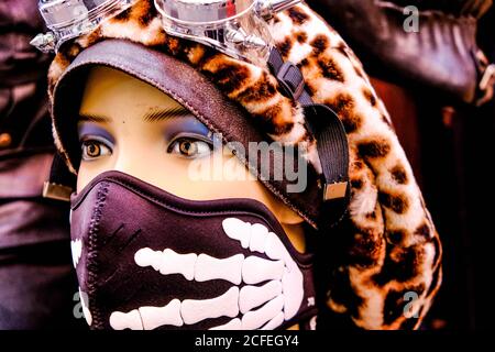 Head Shot Of A Mannequin Wearing A Face Covering And Leopard Print Sixties Hat, Camden Market London UK Stock Photo
