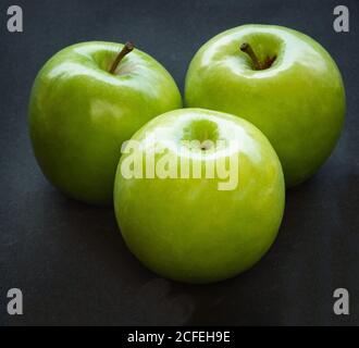 Green apples on dark background Stock Photo