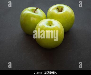 Green apples on dark background Stock Photo