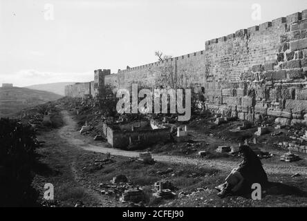 Original Caption:  Around the city wall [Jerusalem]. The east wall showing Herodian wall and Golden Gate  - Location: Jerusalem ca.  1920 Stock Photo
