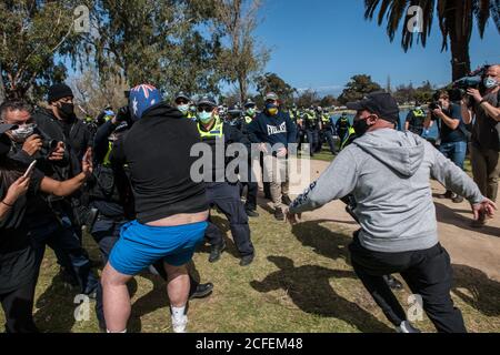 Protesters scuffle with anti-riot police outside City Hall while ...