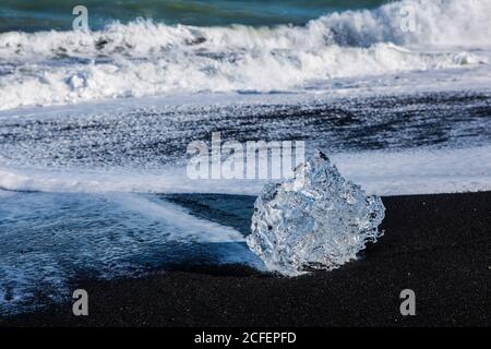 Diamond beach, big ice rocks on a black beach, at south coast of Iceland, on a sunny day, summer time. Stock Photo