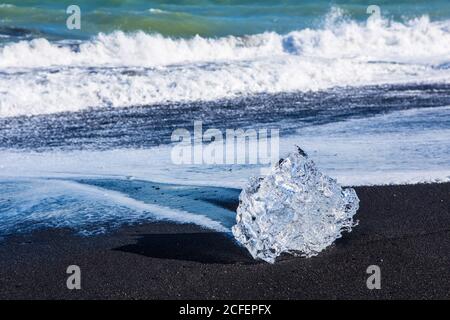 Diamond beach, big ice rocks on a black beach, at south coast of Iceland, on a sunny day, summer time. Stock Photo