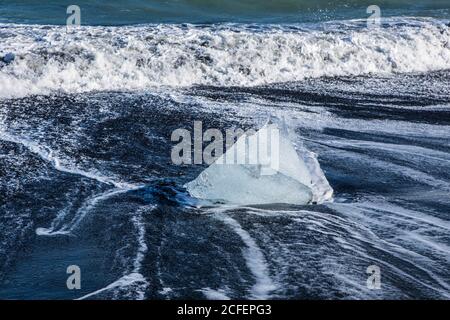 Diamond beach, big ice rocks on a black beach, at south coast of Iceland, on a sunny day, summer time. Stock Photo