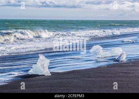 Diamond beach, big ice rocks on a black beach, at south coast of Iceland, on a sunny day, summer time. Stock Photo