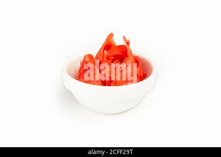 Pickled ginger in a bowl on a white plate. For the restaurant menu. Traditional Japanese sushi seasoning. Healthy eating Stock Photo