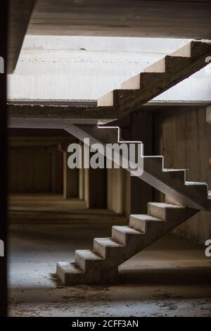 Concrete stairway between levels in building under construction Stock Photo
