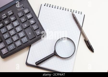 Blank notebook with pen and calculator on whitetable, business concept Stock Photo