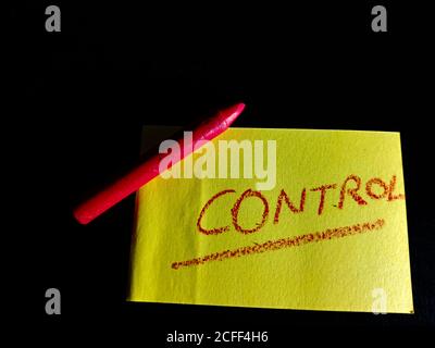 Control word displayed on paper slip concept for educational informative awareness.