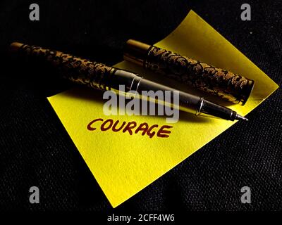 Courage word displayed on paper slip concept for educational informative awareness.