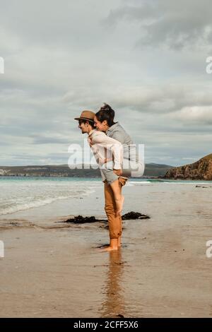 Happy couple having fun on Scottish coast Stock Photo
