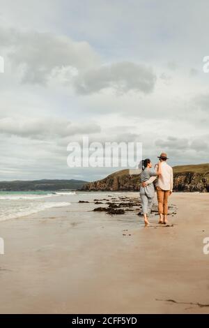 Happy couple having fun on Scottish coast Stock Photo