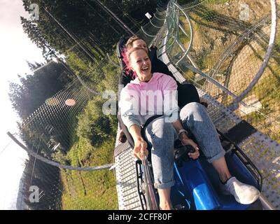 Summer toboggan run rodelbahn with many curves on a mountain