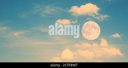 Moon over clouds as nature background. Stock Photo