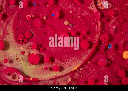 abstract background of multiple bright red bubbles of oil in liquid Stock Photo