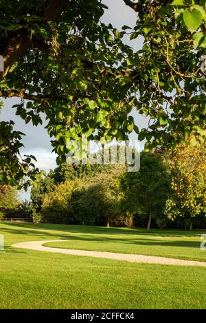 Country House garden with winding gravel path Stock Photo