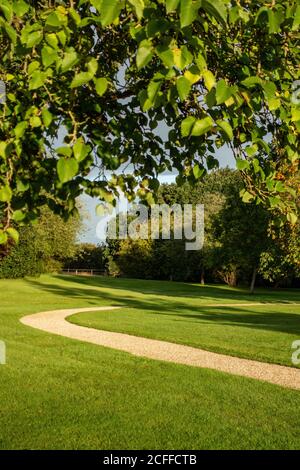 Country House garden with winding gravel path Stock Photo