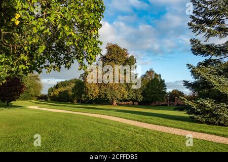 Country House garden with winding gravel path Stock Photo