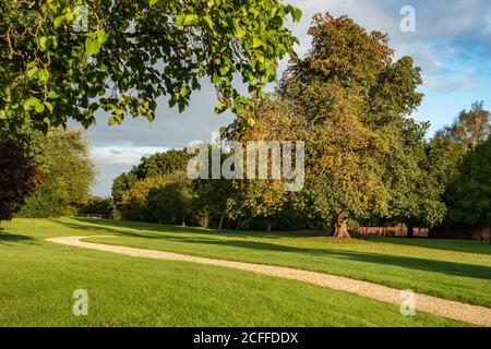 Country House garden with winding gravel path Stock Photo