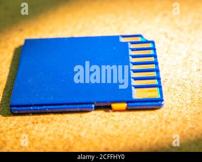 A closeup of a memory card lying on the table. Stock Photo