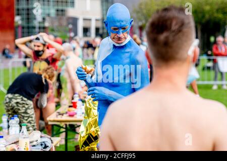 Amsterdam, Netherlands. 05th Sep, 2020. A model is seen covered in blue painting during the Amsterdam Bodypaint Art Event.The Amsterdam Body Art Foundation is organizing the Amsterdam Bodypaint Art Event on the Museumplein for the fourth time on September 5, 2020. Several artists paint the various bodies of models to create a beautiful work of art. The theme this year is “Climate Awareness” thus the encouragement to artists to incorporate plants and animals in their artwork not leaving out the the elements in their creations. Credit: SOPA Images Limited/Alamy Live News Stock Photo