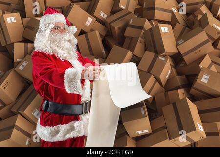 Santa Claus is full of presents request and boxes to delivery Stock Photo