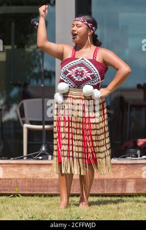 A young Maori in traditional clothes rides on a float during the annual ...