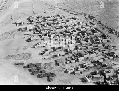 Original Caption:  Air route to Baghdad via Amman and the desert. Iraq typical mud village  - Location: Iraq ca.  1932 Stock Photo