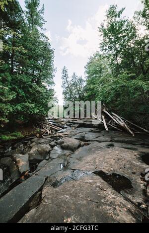 Stream of mountain river flowing through forest in La Mauricie National Park in Quebec, Canada Stock Photo