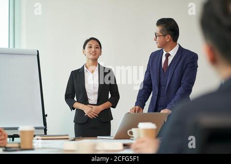 asian manager introducing new employee during staff meeting in conference room Stock Photo