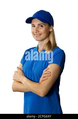 young woman in blue polo shirt and hat with arms crossed isolated on white background Stock Photo