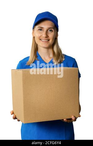delivery service - happy young deliverywoman in blue uniform holding cardboard box. isolated on white background Stock Photo