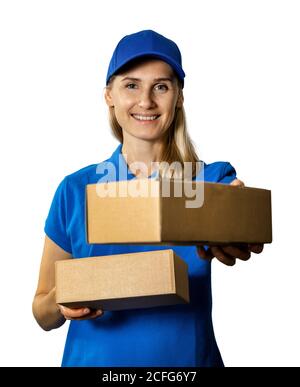 young smiling delivery woman giving cardboard package. isolated on white background Stock Photo