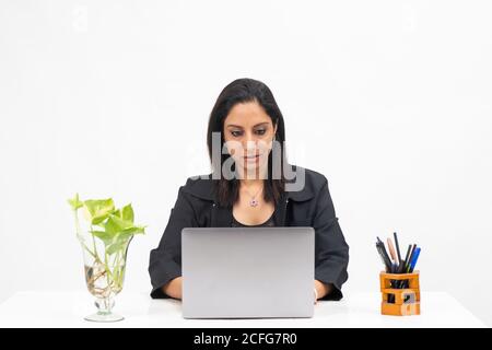 Portrait of professional Indian businesswoman working from her computer, Freelancer, work from home, Serious corporate lady. Stock Photo