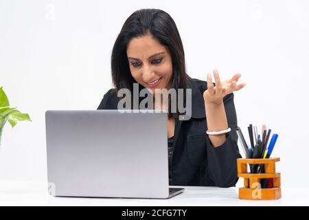 Portrait of professional Indian businesswoman working from her computer, Freelancer, work from home, Smiling corporate lady. Stock Photo
