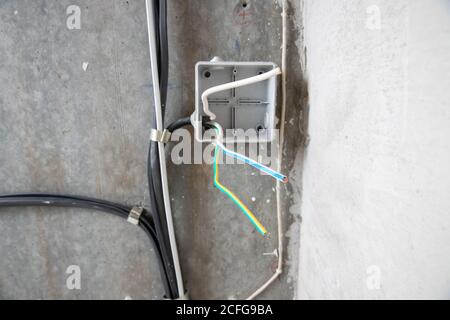 Electrical work, switch box for connecting copper electric wires in apartment Stock Photo
