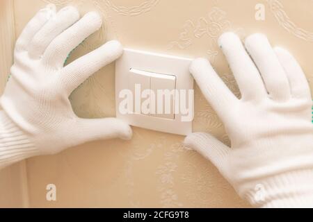 Electrician builder install working switches and sockets black color loft style Stock Photo