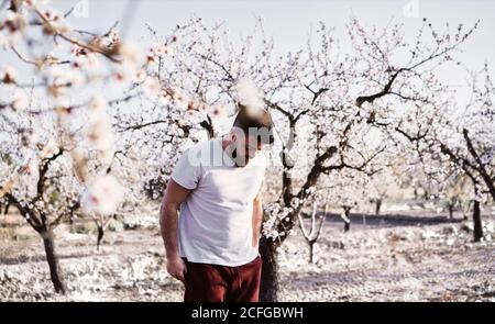 man doing yoga in spring garden Stock Photo