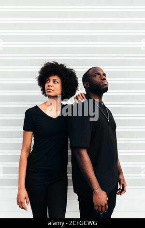 Black cool couple posing over white background looking at camera Stock Photo