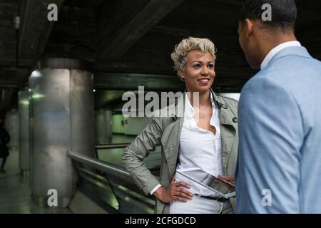 Cheerful elegant African-American man and Woman watching tablet together and smiling. Stock Photo