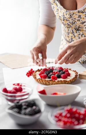 Woman preparing a cake Stock Photo