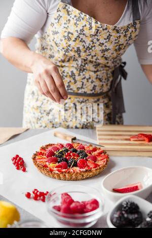 Woman preparing a cake Stock Photo