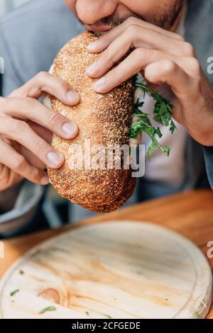 man eating a sandwich Stock Photo