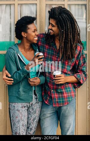 Couple having a drink in the street Stock Photo