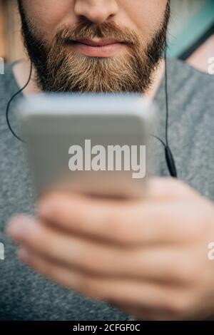 Bearded man using a phone Stock Photo